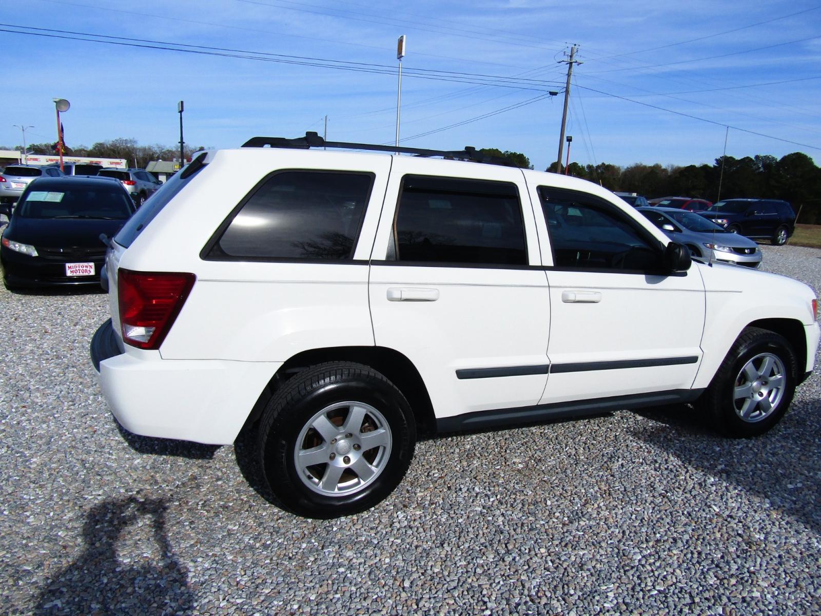 2009 WHITE Jeep Grand Cherokee (1J8GS48KX9C) , Automatic transmission, located at 15016 S Hwy 231, Midland City, AL, 36350, (334) 983-3001, 31.306210, -85.495277 - Photo #7